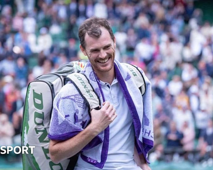 Jamie and Andy Murray touch hands
